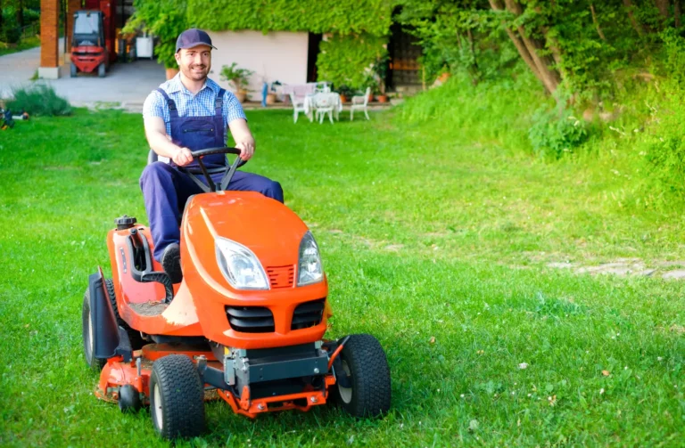 gardener driving red lawnmower. Why Choose Our Lawn Care Services