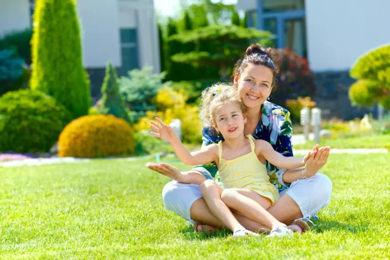 Conquer Lawn Pests : mother and daughter on lawn